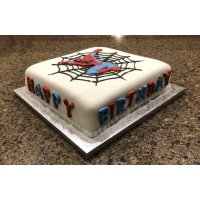 Using an undecorated cake to create a Spider Man themed birthday cake