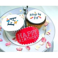A decorative desplay with Blogs By FA logo Cupcakes