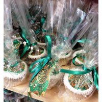 Skandia 'Wrapped in Silk' Logo Cupcakes in bags and tied with a ribbon