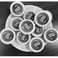 Irwin Mitchell celebrating 25 years with logo cupcakes